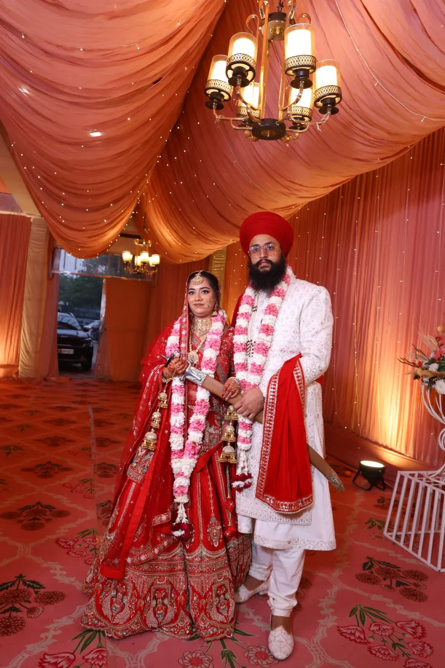 Couple portrait walking together after the jaimala ceremony