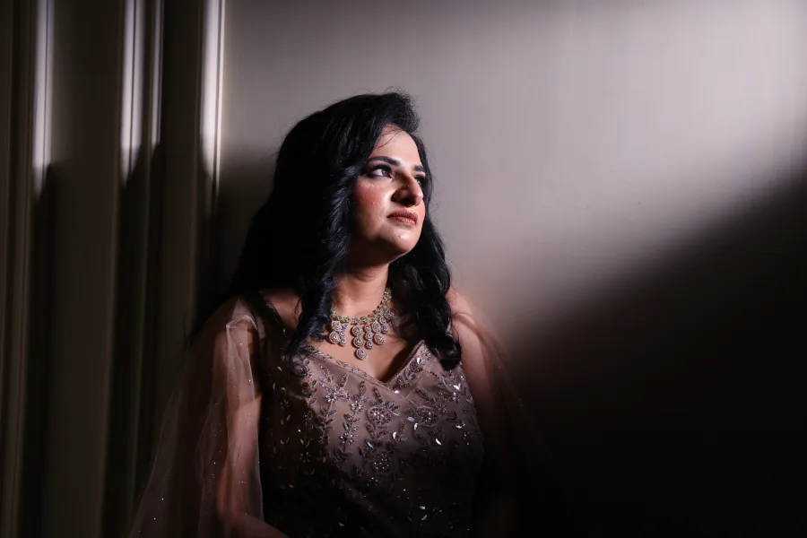 Reception portrait of the bride bathed in soft light