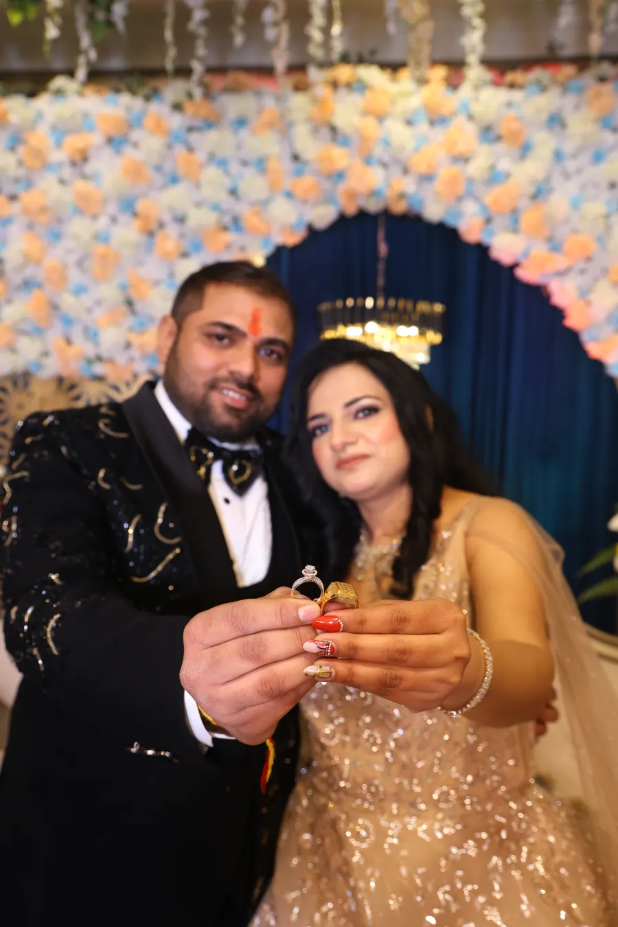 Couple showing off the engagement ring